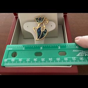 Duri gold tone and puma shell flower and leaf.